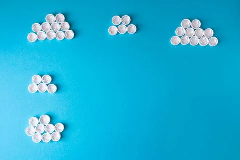 White clouds made of plastic bottle caps Stock Photos