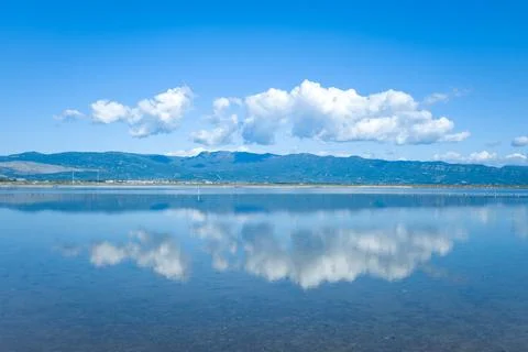 White clouds mirrored on Missolonghi salt flats Stock Photos