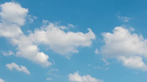 White clouds move across the blue sky, Sunny summer day. Stock Footage 86690468