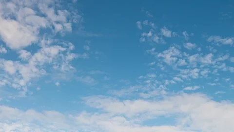White clouds move across the blue sky Stock Footage 87536086