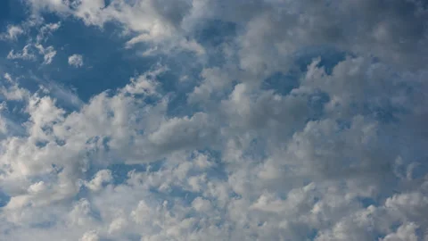 White clouds move fast across the blue sky Stock Footage 160464995