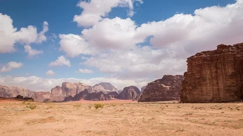 White clouds move fast over the red rocks in stone desert Stock Footage 109072241