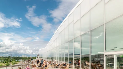 White clouds move over the Helsinki Central Library Oodi. Time lapse video. Stock Footage 248098797