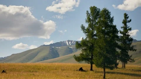 White clouds move over the tops of mountains Stock Footage 167505062