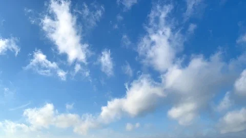 White clouds move rapidly across the blue sky. Stock Footage 104395706