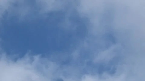 White clouds moved quickly across the blue sky Stock Footage 280376080