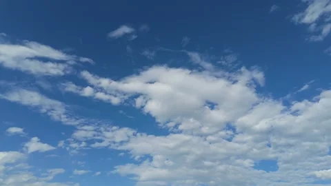 White Clouds Moving Across Blue Sky Timelapse Stock-Footage 335085650