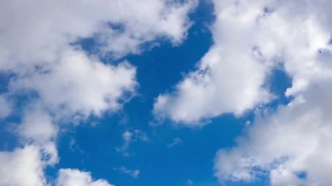 White clouds moving against blue sky Stock Footage 75841696