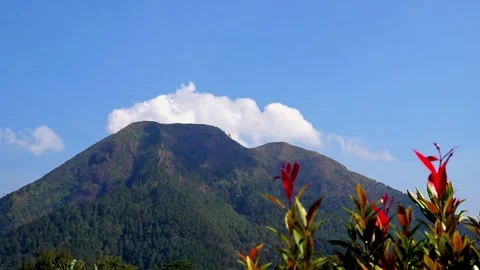 White clouds moving around the beautiful mountains Stock Footage 252572656