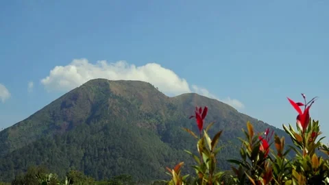 White clouds moving around the beautiful mountains Stock Footage 252572710