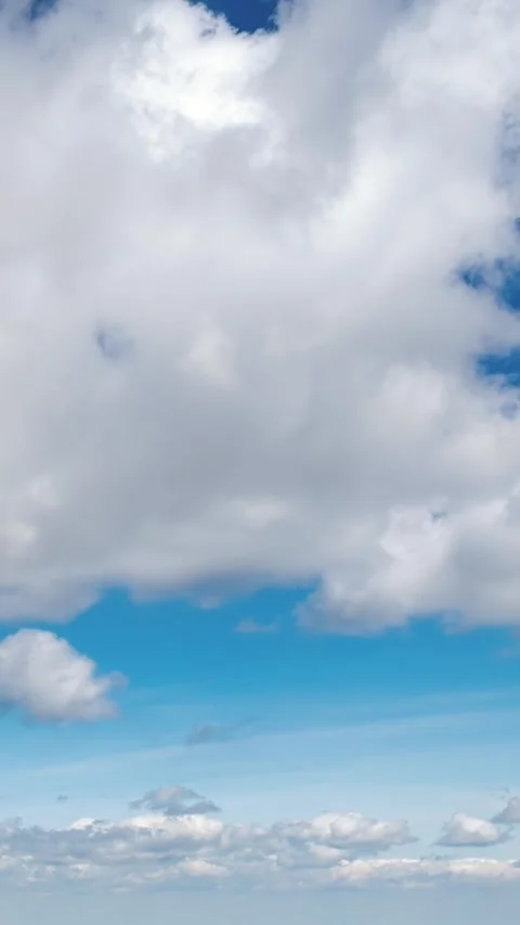 White Clouds Moving in Blue Sky Background Vertical Time Lapse Stock Footage 310829252