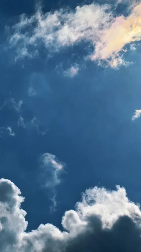 White clouds moving on clear blue sky Stock Footage 334075618