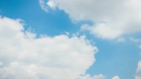 White clouds moving fast on blue sky. 4K time lapse video without sound Stock Footage 131367264