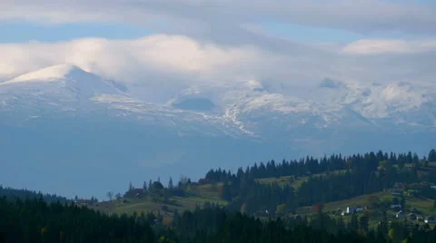 White Clouds Moving Fast Over the Mountains. Stock Footage 56853089