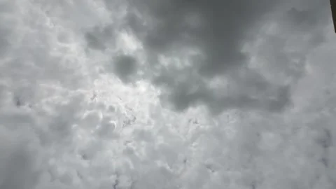 White Clouds Moving Fast At Viewer In The Hot Sun On Blue Sky Timelapse Video Stock Footage 283801299