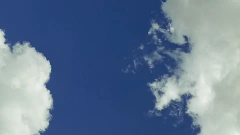 White clouds moving over blue sky timelapse Stock Footage 91159874