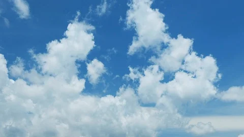 White clouds moving over blue sky Stock Footage 114181533