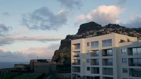White clouds moving over coastal houses in madeira Vidéo 333695076