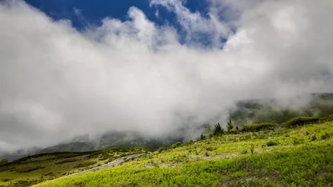 White clouds moving over green mountain landscape in Madeira Island. Stock Footage 333602525