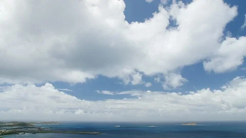 White Clouds Moving Over Ocean and Tropical Island, Boats in Water Vídeo Stock 102351294