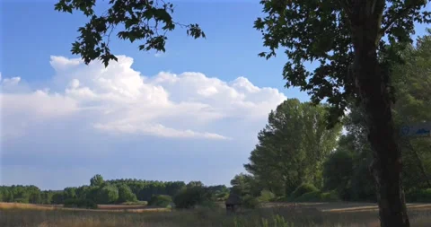 White clouds moving over a rural landscape in Quintana Redonda Vídeo Stock 344043685