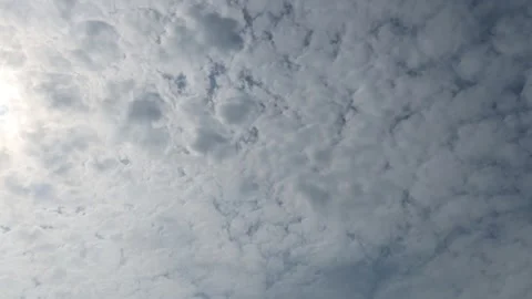 White clouds moving on sky. Sun light comes through coulds. Timelapse video. Stock-Footage 229254613