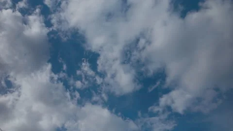White clouds moving with speed on blue sky Stock Footage 175334327