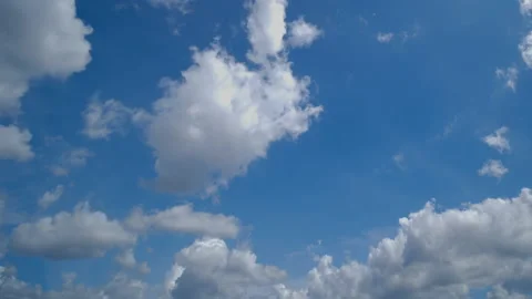 White clouds moving with speed on blue sky Stock Footage 221824889