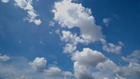 White clouds moving with speed on blue sky Stock Footage 221996277