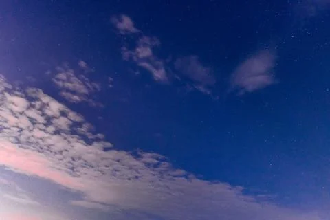 White clouds in the night Stock Photos