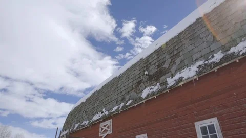 White clouds over barn on a sunny day Stock Footage 83864838