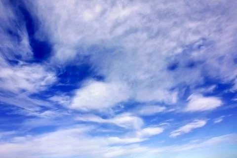 White clouds over blue sky Stock Photos