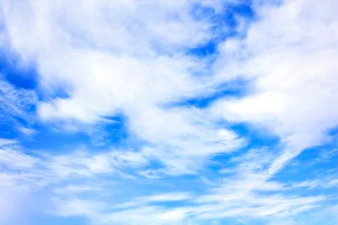 White clouds over blue sky Stock Photos
