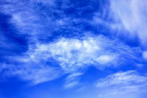 White clouds over blue sky Stock Photos