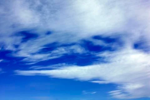 White clouds over blue sky Stock Photos