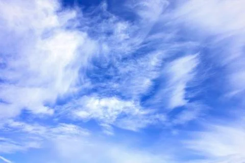 White clouds over blue sky Stock Photos