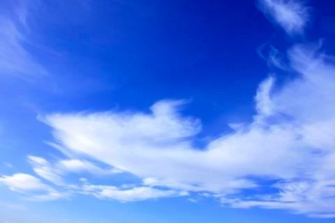 White clouds over blue sky Stock Photos