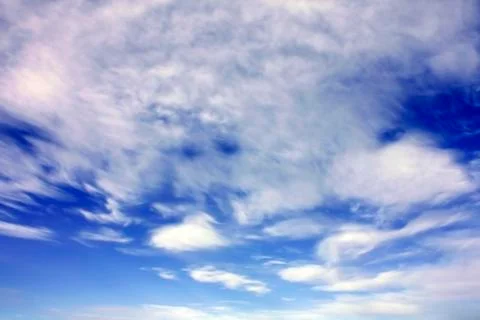 White clouds over blue sky Stock Photos