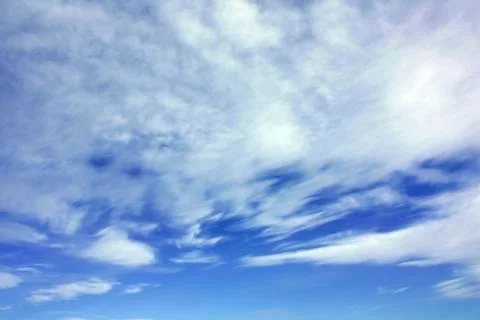 White clouds over blue sky Stock Photos