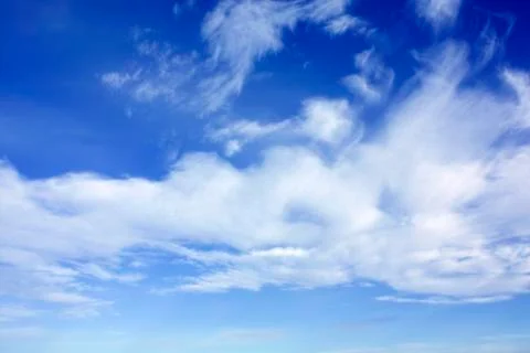White clouds over blue sky Stock Photos