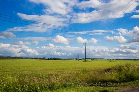 White clouds over the field Stock Photos