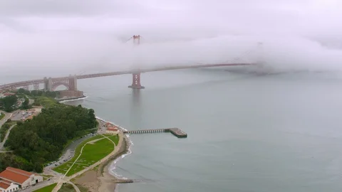 White clouds over the Golden Gate Bridge and coastline Stock Footage 96404905