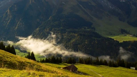 White clouds over green landscape and mountain Stock Footage 76004807