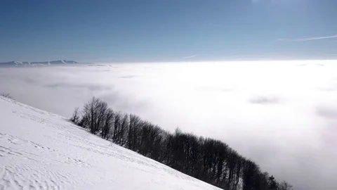 White Clouds Over High Snowed Mountains, Top Pan View Stock Footage 71198894