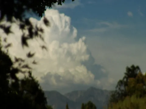 White clouds over mountain background Stock Footage 106221808