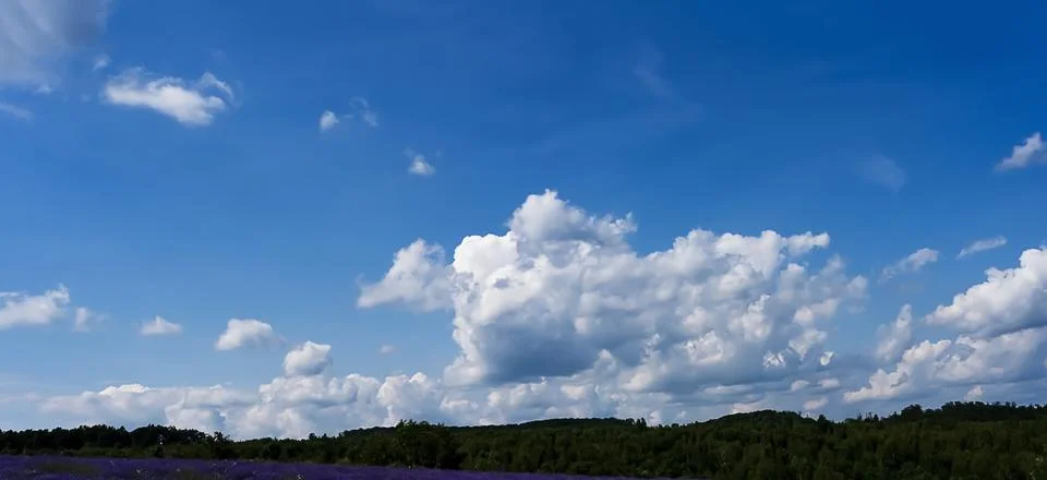 White clouds over the mountains, fluffy clouds, panorama Stock Photos