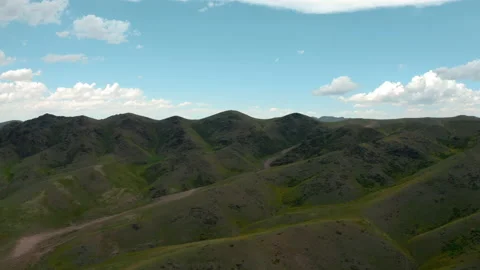 White clouds over the mountains Stock Footage 237014209