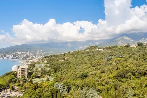 White clouds over the mountains. Stock Photos