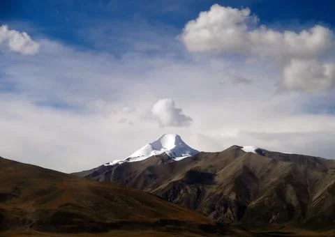 White clouds over the mountains Stock Photos