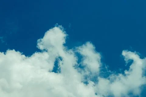 White clouds over the nice and decorous beautiful blue sky Stock Photos
